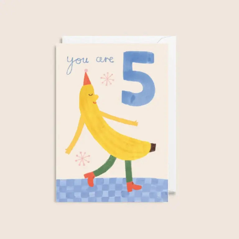 Birthday card with a cartoon banana character and number 5 on a beige background