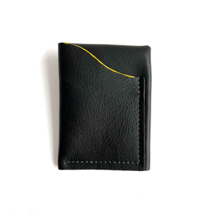 Rectangular dark green wallet with yellow painted detail.