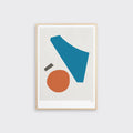 A framed print featuring an abstract geometric design. The image includes a large blue shape, a smaller orange circle, and a small grey rectangle on a beige background.