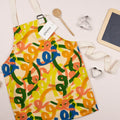 Kids apron with squiggle pattern, laid flat on a surface