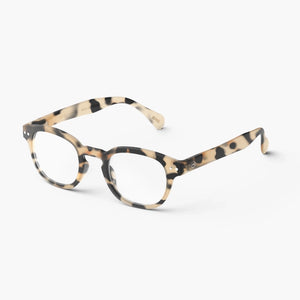 Reading glasses in tortoise shell pattern against white backdrop
