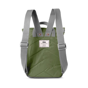 Reverse of green backpack with grey straps and Roka logo stitched onto the bag.