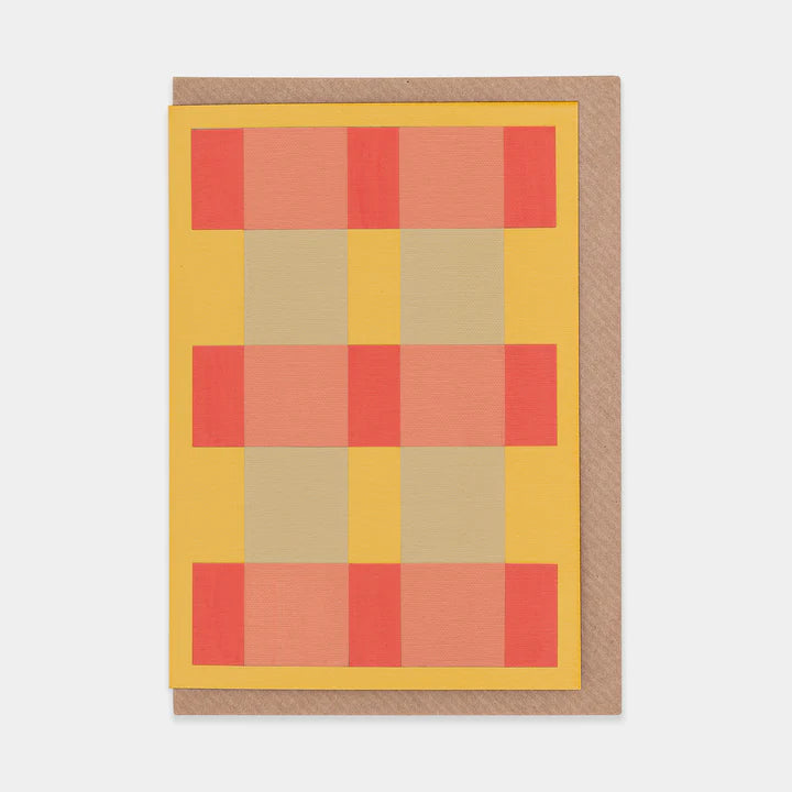 Greetings card featuring an abstract orange, red and grey check design. Brown envelope.