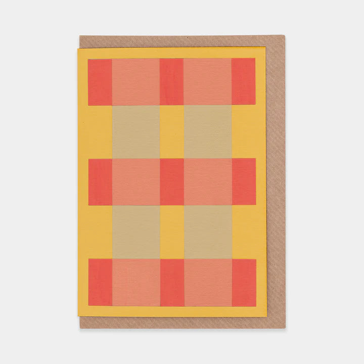 Greetings card featuring an abstract orange, red and grey check design. Brown envelope.