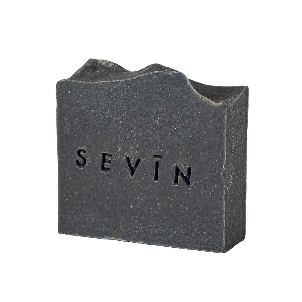 Black soap bar with 'SEVIN' branding on a white background
