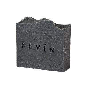 Black soap bar with 'SEVIN' branding on a white background