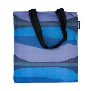 Tote bag with black handle featuring a blue design by Shirley Craven
