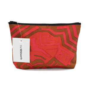 Cosmetics bag featuring a red and pink design by Shirley Craven