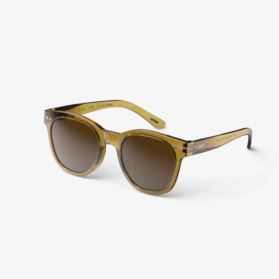 Golden green sunglasses against white background