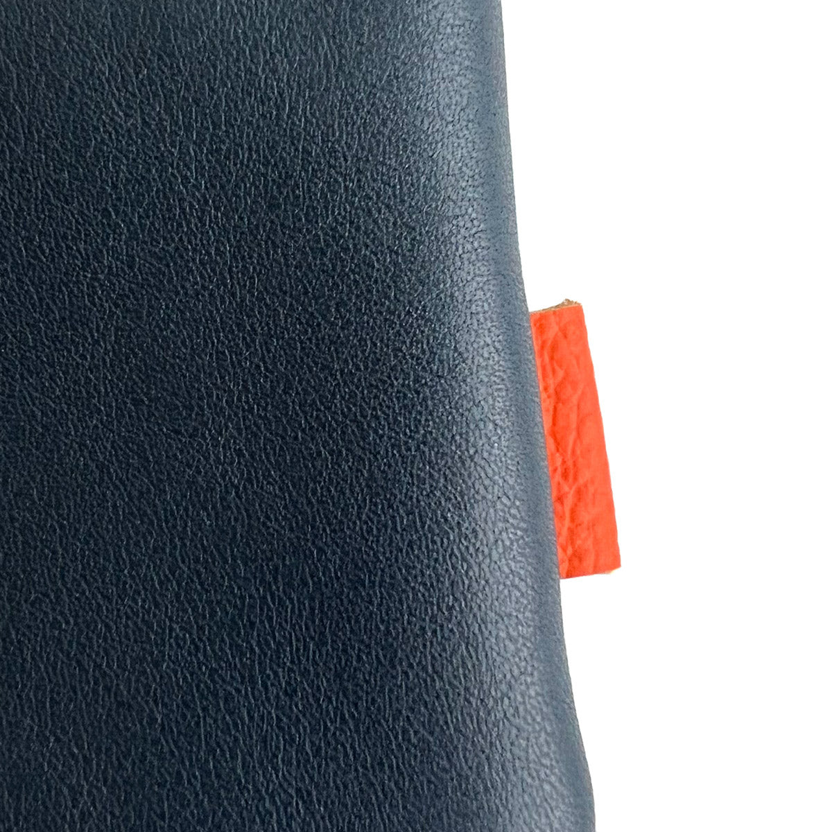 Detail of bag featuring orange label sewed into the right hand side.