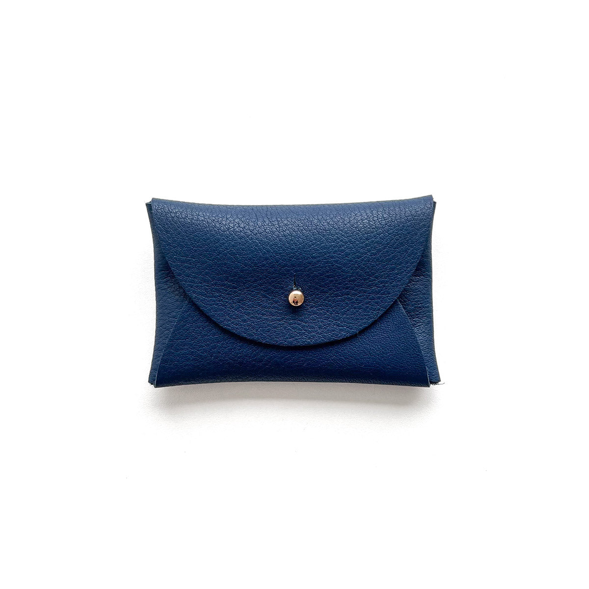 Rectangular navy leather purse with silver button, presented on a white background