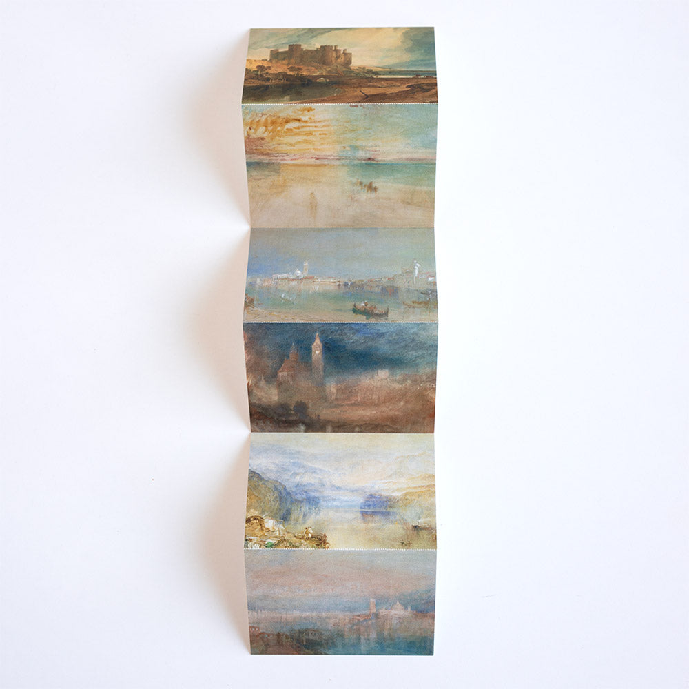 Set of concertina style postcards with scenic images on a white background