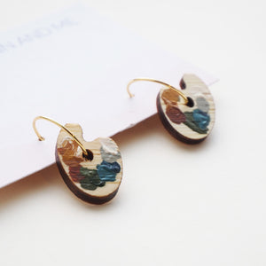 Earrings in the shape of a paint palette with gold hoop fastenings