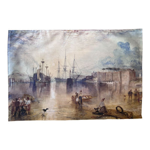 Tea towel featuring J.M.W Turner painting of a harbour scene with ships and people on a white background