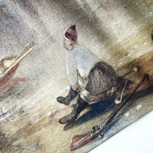Close up of the tea towel featuring a person sat down