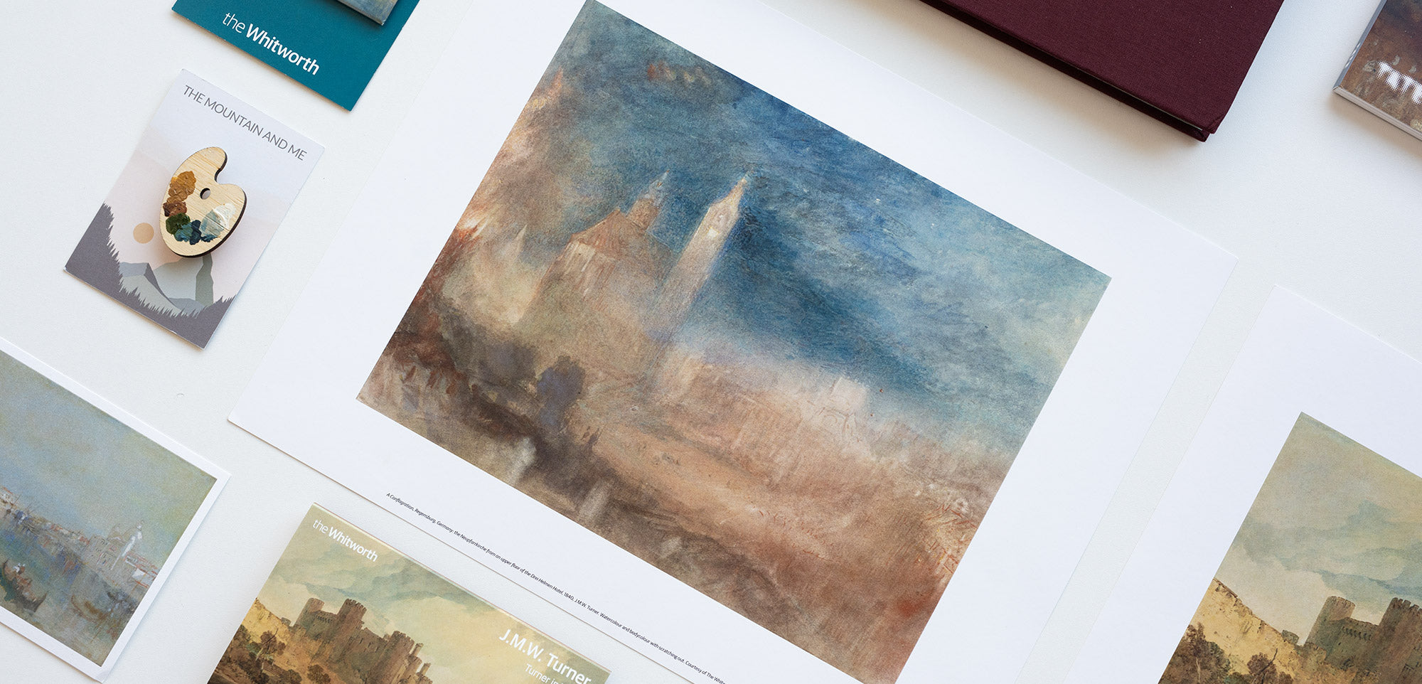 Collection of Turner watercolour reproductions on a white surface.