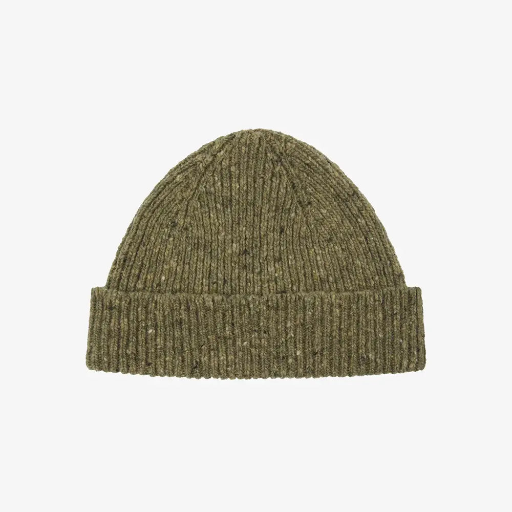 Green beanie against white background