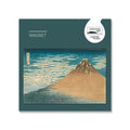 Magnet featuring Red Fuji, against green backing card