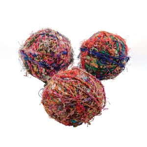 Three balls of recycled hemp wool. The wool is multi-coloured. Photographed against a white background.