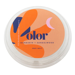 Circle metal packaging of a wax melt with Orange Olar branding