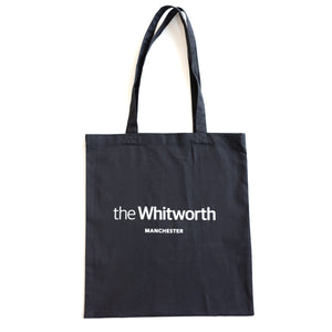 Black coloured tote bag with Whitworth logo against white background.