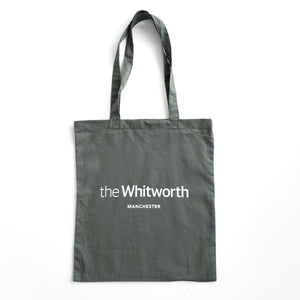 Olive green coloured tote bag with Whitworth logo against white background.