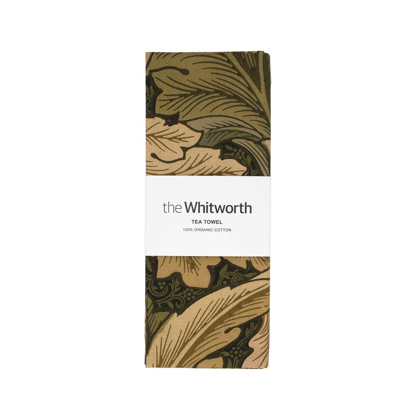 Tea towel featuring William Morris Acanthus leafy pattern. Wrapped around the tea towel is a belly band with the Whitworth's branding on it. White background.