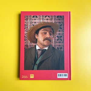 Book cover with a person in a suit and hat on a yellow background
