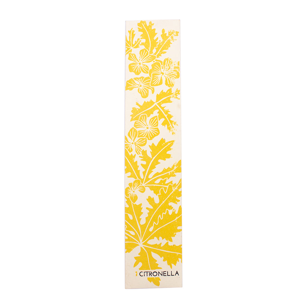 Incense packaging with yellow floral design on a white background