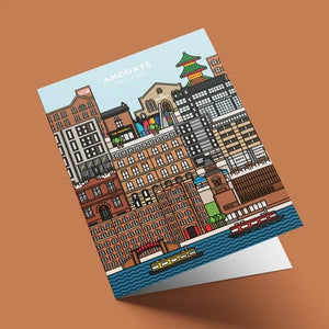 Greetings card illustration of the Ancoats, Manchester skyline, featuring various buildings in a colorful, illustrated style. The text "Ancoats, England" appears at the top of the image. 