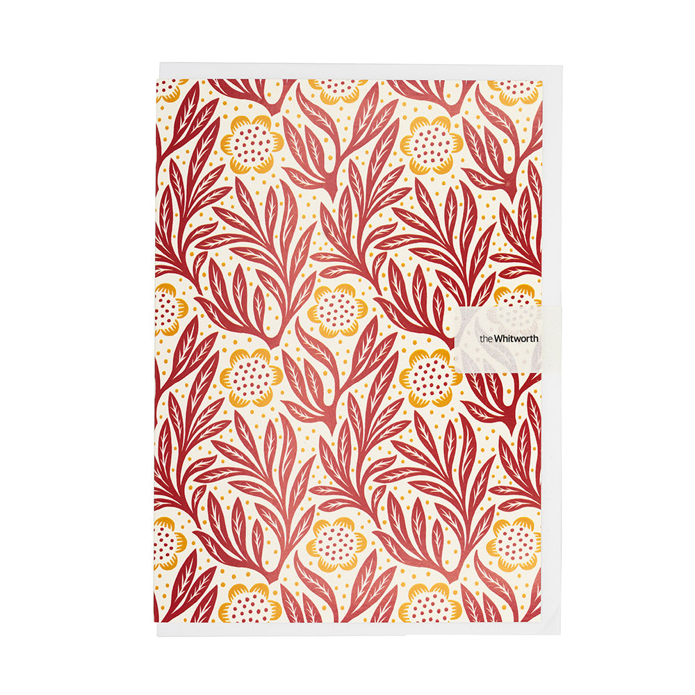 Greetings card with red floral pattern on a white background