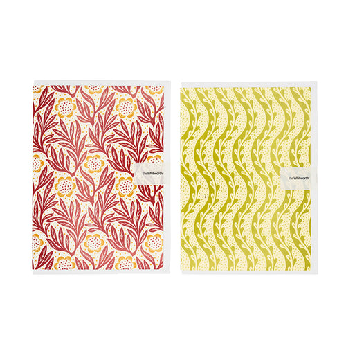 Two patterned greetings cards with floral and wavy designs on a white background