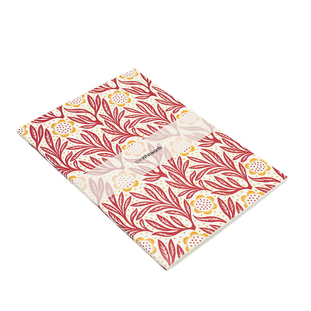 Red patterned notebook on a white background