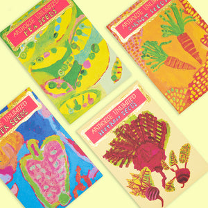 A series of colourful seed packets photographed from a birds eye view.