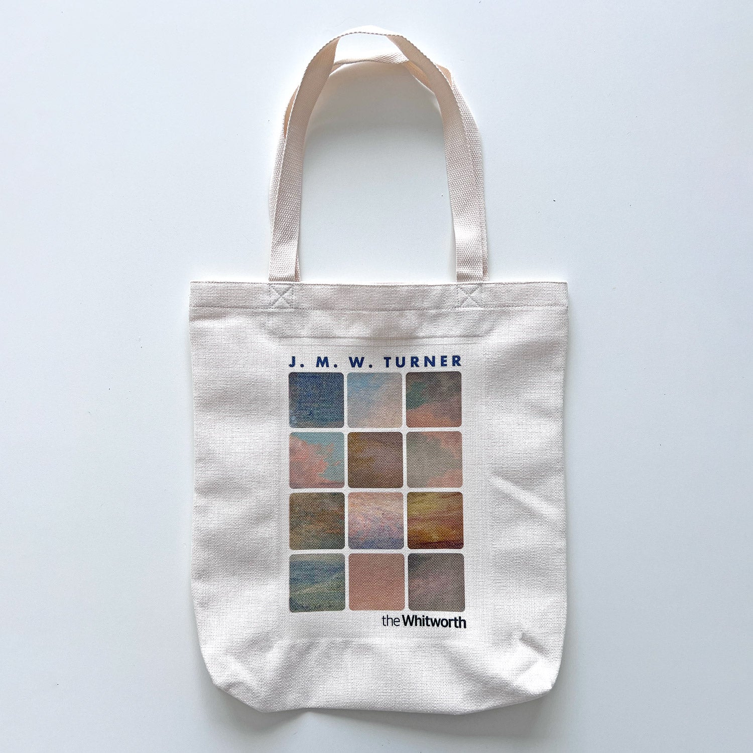 White tote bag with J. M. W. Turner design on a light gray background