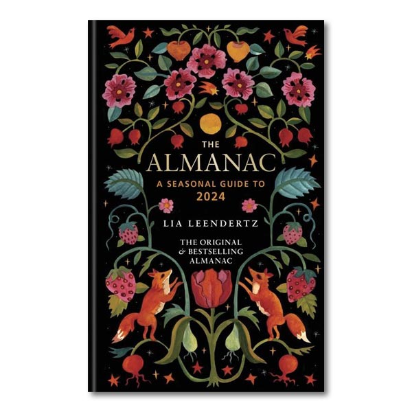 Book cover with a symmetrical floral pattern with foxes, against a black background.