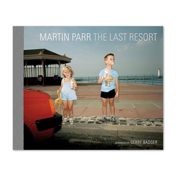 Book cover featuring a photograph by Martin Parr of two children at the beach eating ice cream