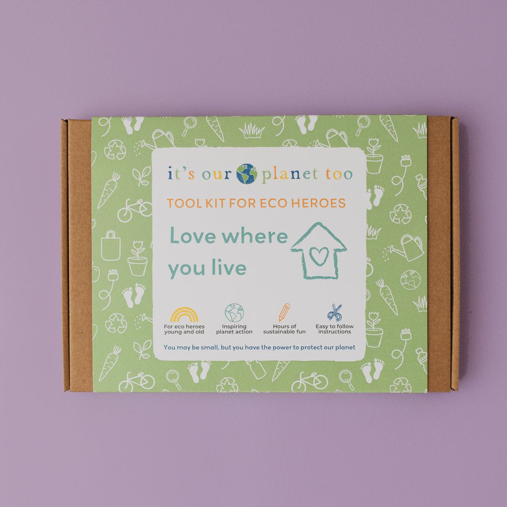 Colourful box packaging for an eco kit for children against a purple backdrop.