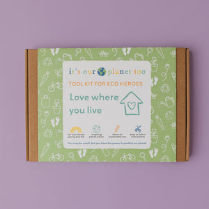 Colourful box packaging for an eco kit for children against a purple backdrop.