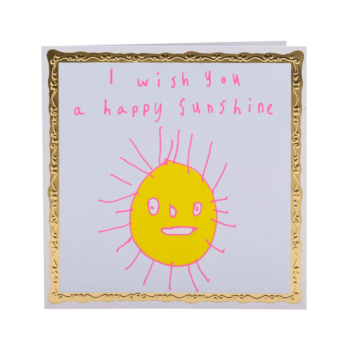 A white greeting card with a gold border. In the centre is a child-like drawing of a yellow sun with a smiling face and pink rays. Text in pink reads "I wish you a happy sunshine."