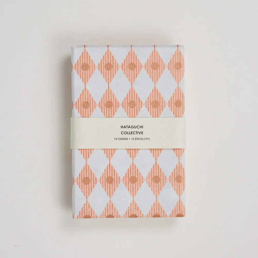 Box packaging for card set featuring white and peach gemetric design