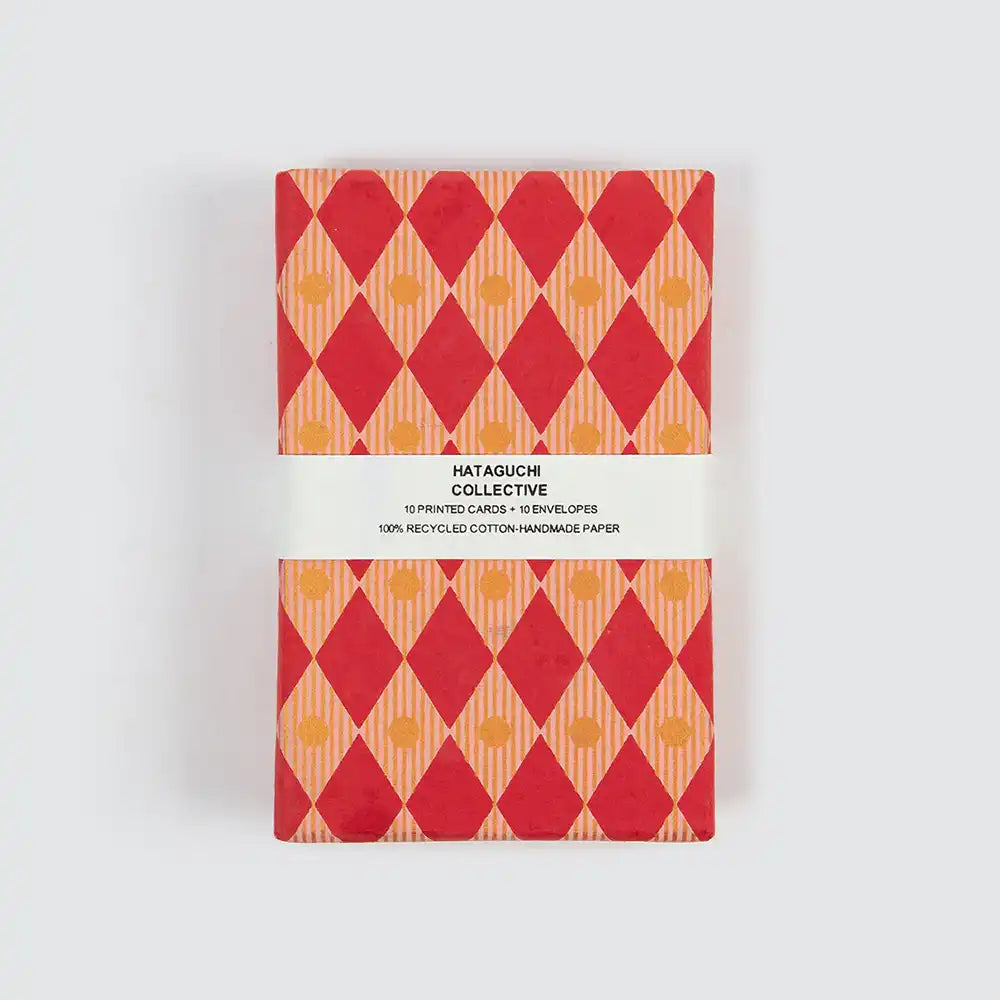 Box packaging for card set featuring red and yellow geometric design