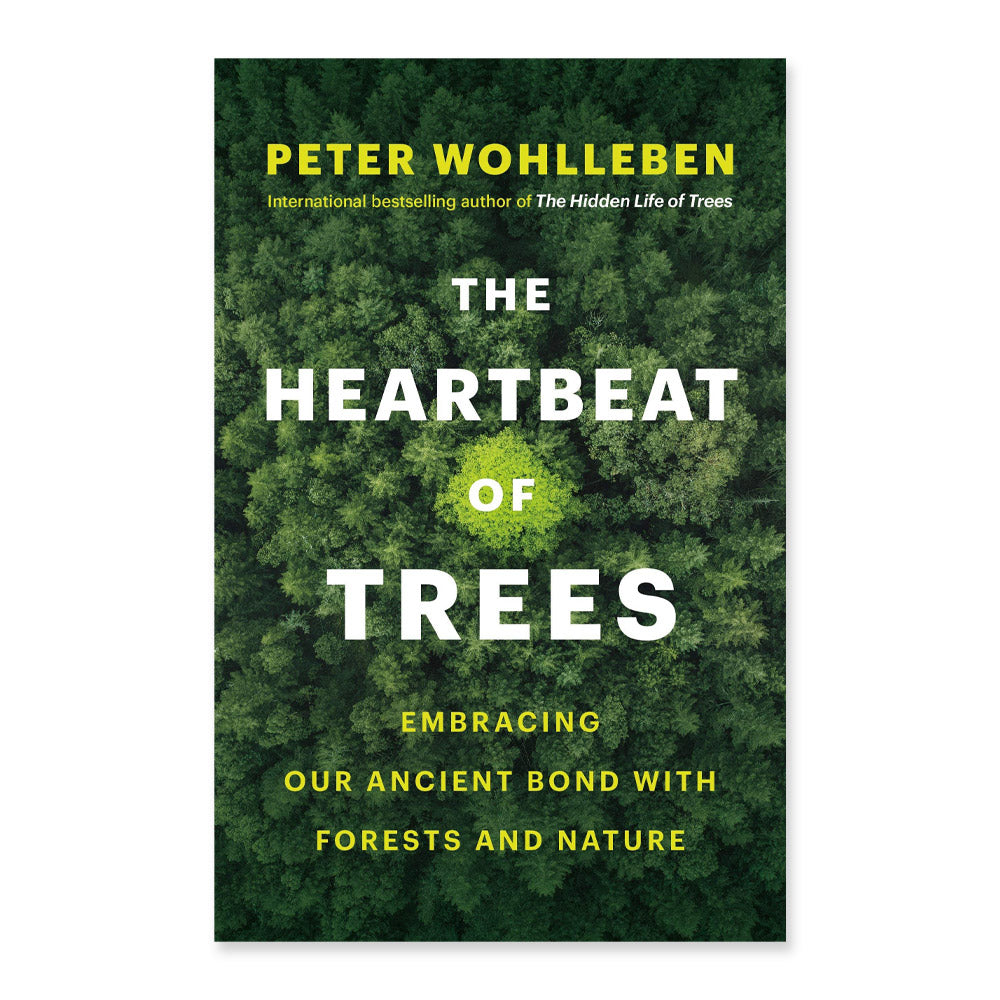 Book cover of 'The Heartbeat of Trees' by Peter Wohlleben with a forest background.