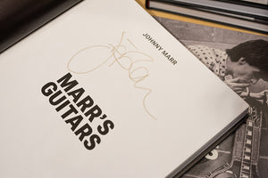 Close up of the inside page of the book Johnny Marr's signature is placed above the title