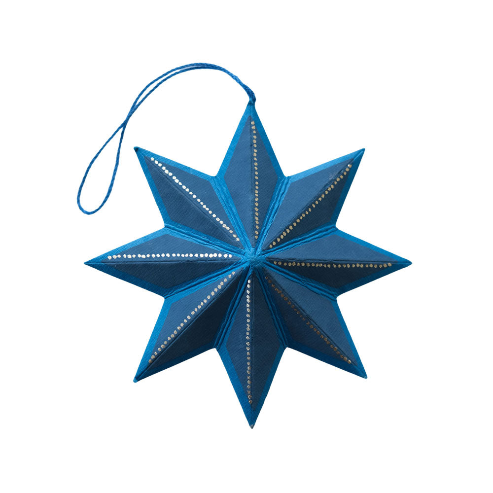 Blue star-shaped ornament with a string on a white background