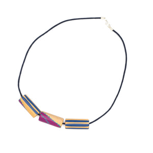 Necklace with thread chain. Three wooden shapes handpainted with blue and pink geometric shapes.