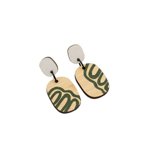 Hand painted wooden earrings. Each earring has a white oval shape at the top and beneath is a larger oval shape with hand-painted green swirls