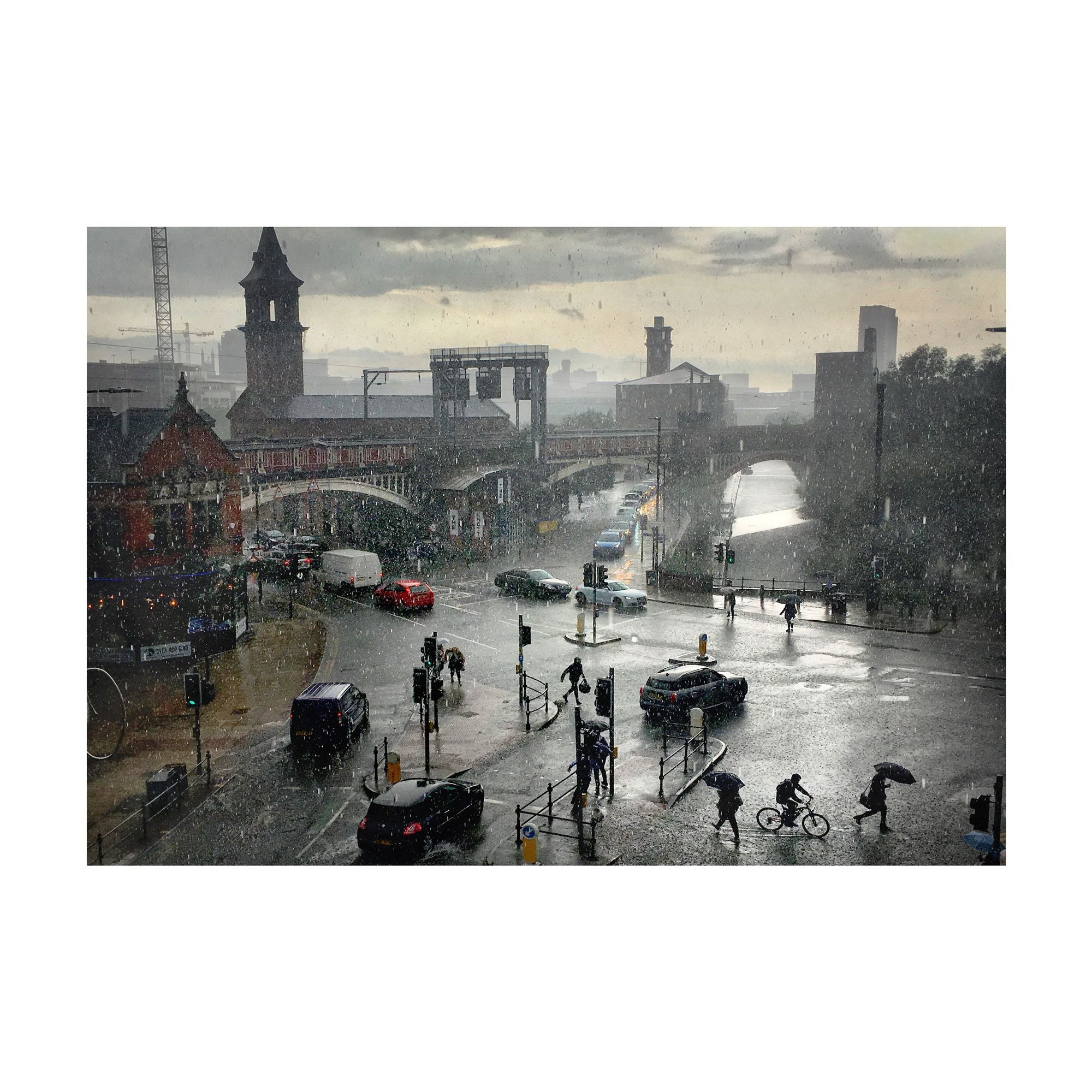 Simon Buckley of Not Quite Light, photography of a rainstorm by a traffic light near Deansgate.