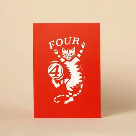 Red card with white cat design and number '4' on a beige background