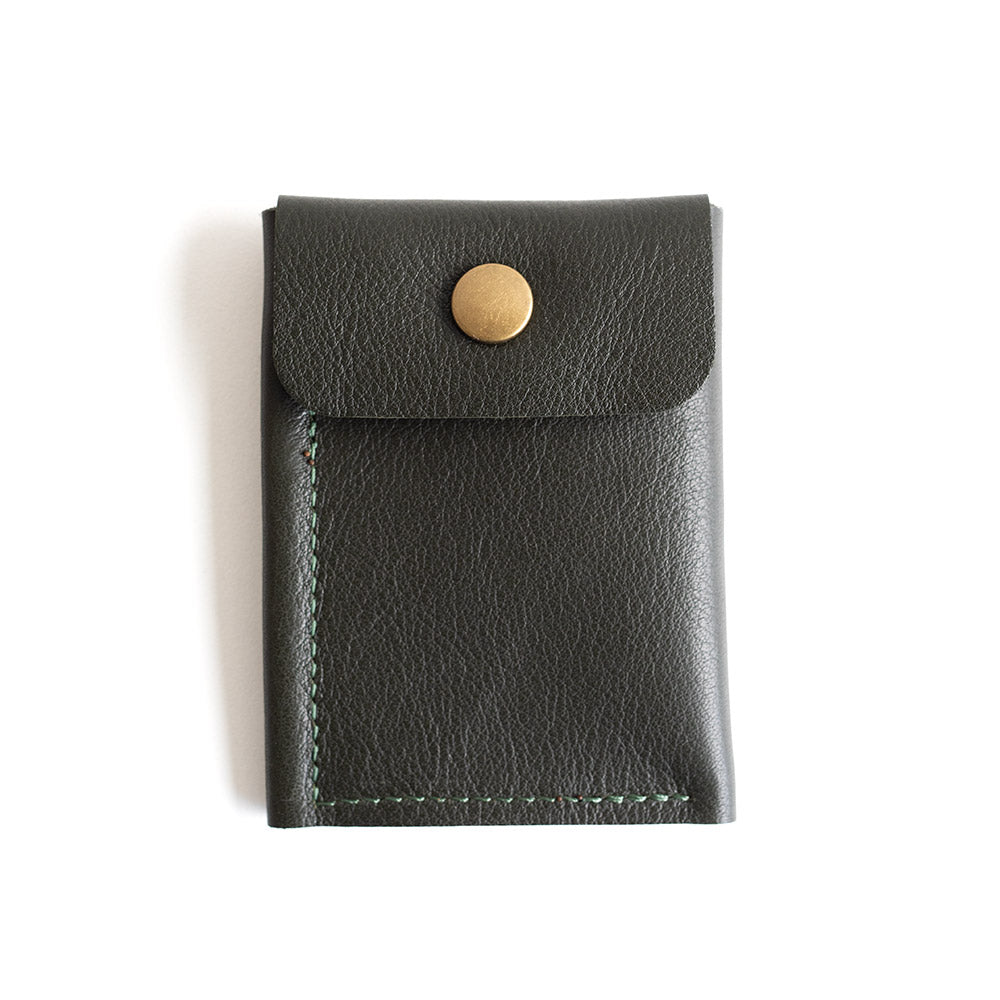 Black leather wallet with a gold button on a white background